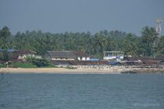 View of Mappila Bay with boats and an overcast sky