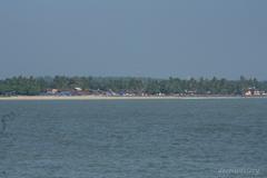 View of Mappila Bay with a fishing boat and serene waters