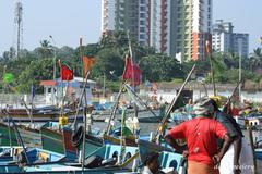 Scenic view of Mappila Bay with boats anchored near the shore