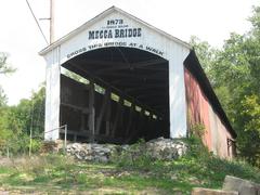 Western portal and southern side of the Mecca Covered Bridge spanning Big Raccoon Creek in Mecca, Indiana