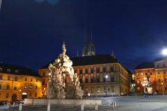 Zelný trh square in Brno at dusk with Ditrichstein Palace in the background