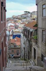 Street in Lisbon with historic buildings and tram