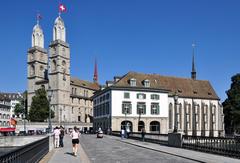 Grossmünster and Wasserkirche at Limmatquai in Zürich as seen from Münsterhof with Münsterbrücke in the foreground