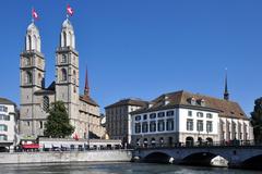 Grossmünster and Helmhaus-Wasserkirche at Limmatquai in Zürich, Switzerland, viewed from Wühre and Münsterhof, Münsterbrücke in the foreground.