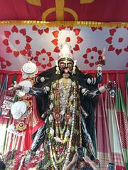 Boro Maa idol decorated with gold and silver jewellery