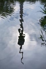 Reflection of Donauturm in Irissee at Donaupark in Vienna, Austria