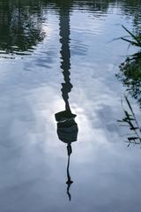 Reflection of Donauturm in Irissee at Donaupark in Vienna, Austria