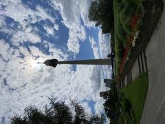 Donauturm in Donaupark with green trees and blue sky