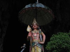 Statue of Sri Murugan with an umbrella at Batu Caves