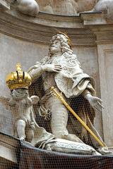 Emperor Leopold kneeling and praying to a sculpture at the Pestsäule in Vienna