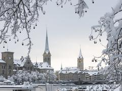 Church towers in snowy Zurich with Fraumünster on the left and St. Peter on the right