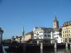 Limmat river in Zürich with Rathausbrücke and church spires