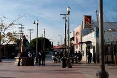 Mariachi Plaza statue in Boyle Heights, Los Angeles with mariachi bands available for hire in the background