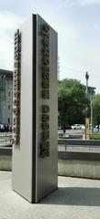 Stele with bilingual inscription in front of the Swiss National Museum in Zurich