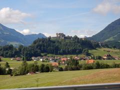 panoramic view of Gruyères, Switzerland with mountains and quaint buildings