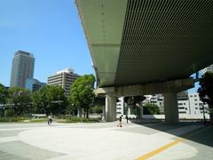 Panoramic view of Nakanoshima, an island in Osaka, Japan, featuring a mix of modern and traditional architecture with lush greenery