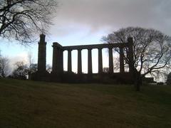 Edinburgh's Disgrace on Calton Hill with unfinished Parthenon-style pillars and Lord Nelson tower