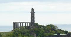 Calton Hill as seen from Edinburgh Castle with National Monument and Nelson Monument