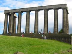 Panoramic view of Edinburgh cityscape with historic buildings and hills