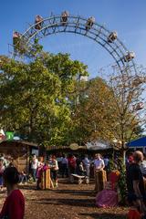 2014 Wiener Wiesn-Fest event showing a crowded scene with people, beer tents, and traditional Austrian attire