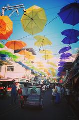 busy street in Liliw Laguna with decorative umbrellas