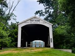 Front view of Neet Covered Bridge showing the year built and builders in Indiana