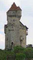 Panoramic view of Burg Liechtenstein castle surrounded by lush greenery