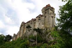 Burg Liechtenstein castle on a sunny day with blue sky and clouds