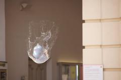 a colorful soap bubble against a dark background