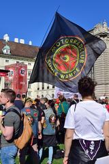 Protesters holding banners and signs at a demonstration