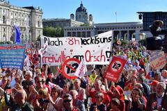 Demonstration 'Nein zum 12-Stunden-Tag' with people holding banners and posters