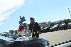 policeman standing in front of horse statue at Vienna's Hofburg Palace