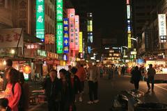 Liouho Night Market at night with illuminated stalls and people