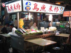 Liouho Night Market in Kaohsiung at night with vibrant lights and bustling atmosphere