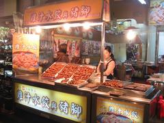 Liouho Night Market at night with bright lights and crowded stalls