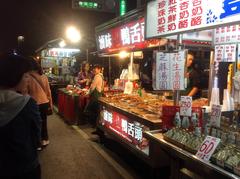 stall selling cooked duck tongue at Liuhe Tourist Night Market in Kaohsiung, Taiwan