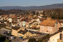 Aerial view of the town of La Sarraz with mountains in the background