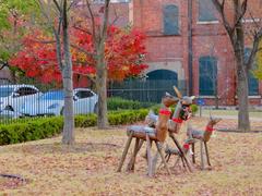 Christmas decoration reindeer made of wood in Noritake Garden with autumn foliage