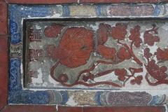 Brick carvings on a residential building wall in Dasha District, Kaohsiung