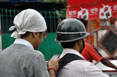 bikers using mobile phones in Kolkata