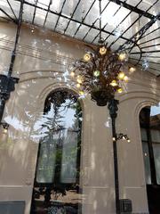 Winter garden of Palacio Cousiño with an Art Deco lamp and metal and glass ceiling