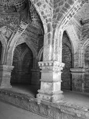 Corridors of Panhala Fort with rows of stone pillars