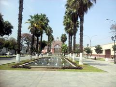 Monument in Peru with arches and urban background