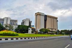 Hotel Aryaduta building with a pool in front