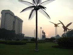 Aryaduta Hotel and Tugu Pak Tani at sunrise in Menteng Prapatan, Jakarta