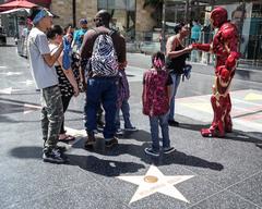 Iron Man standing near Peter Frampton's star on the Hollywood Walk of Fame