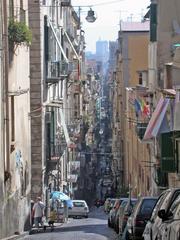 Spaccanapoli street with colorful buildings and narrow alley in Naples, Italy