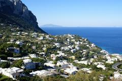 View of Capri island with crystal clear blue waters and rocky cliffs