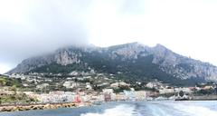 aerial view of Capri island, Italy with limestone cliffs and blue sea, taken in 2017