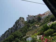 Capri island view with cliffs and blue sea